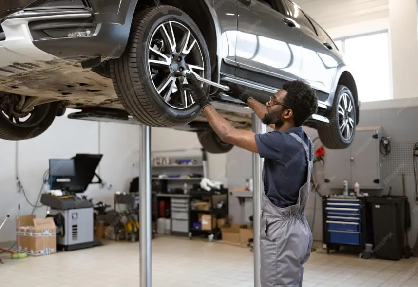 Mechanic working on vehicle